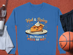 This unisex Hot & Spicy sweatshirt by Garment Graphics features a cheerful pie with whipped cream and reads, You Wanna a Piece of Me? Its styled with a towel, water bottle, black shorts, and basketball for an energetic vibe.