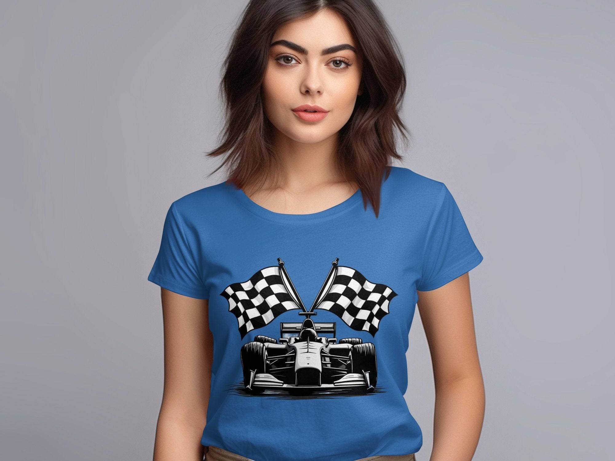 A woman with shoulder-length brown hair wears a blue Garment Graphics T-shirt depicting a race car and two checkered flags, ideal for motorsport fans. She stands against a plain gray background.