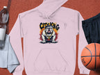 The Garment Graphics pink hoodie featuring a bulldog design with CITY KING text is displayed on a textured surface. Urban edge style is highlighted alongside a clear water bottle, gray towel, black shorts, and an orange basketball.
