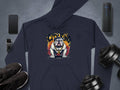 Garment Graphics navy blue hoodie with Graphic Bulldog Design and CITY KING text at the center is ideal for casual wardrobes, showcased with a smartphone, portable speaker, smartwatch, shoes, and dumbbells on a gray background.