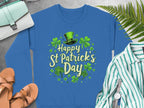 Garment Graphics blue shamrock graphic sweatshirt, featuring Happy St Patricks Day, boasts festive shamrocks and a green top hat. It pairs well with sandals, a striped shirt, a watch, and a green purse against vibrant ferns on a gray backdrop.