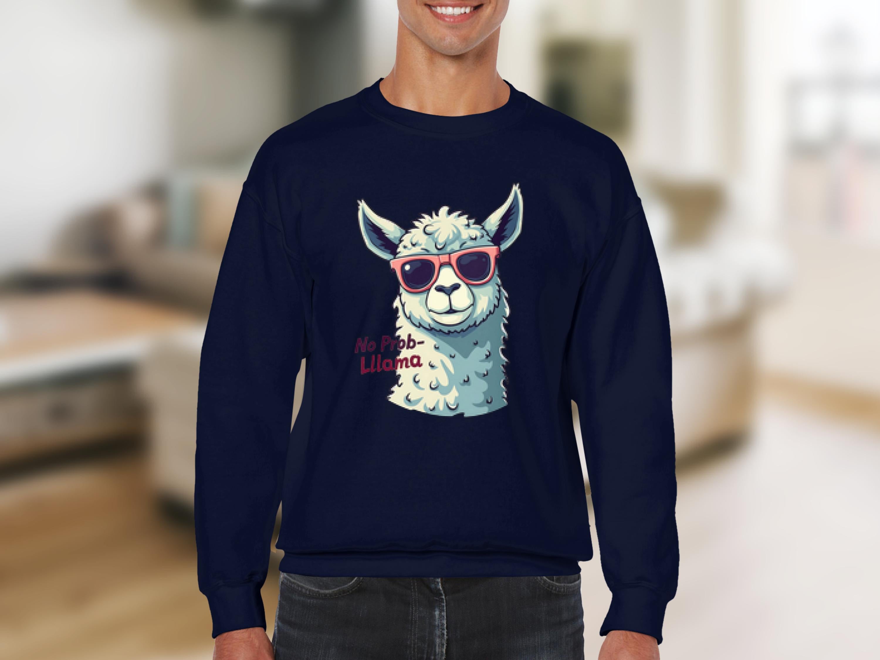 A person wears a humorous Garment Graphics No Prob-Llama sweatshirt with a llama in red sunglasses against a blurred indoor backdrop. The unisex sizing ensures comfort for anyone wanting to add humor to their wardrobe.