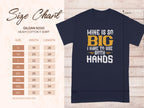 On the left, a size chart for Garment Graphics Gildan 5000 heavy cotton t-shirt shows sizes S to 5XL with dimensions in inches. On the right, a navy graphic tee features a humorous design stating: Mine is so big I have to use both hands.