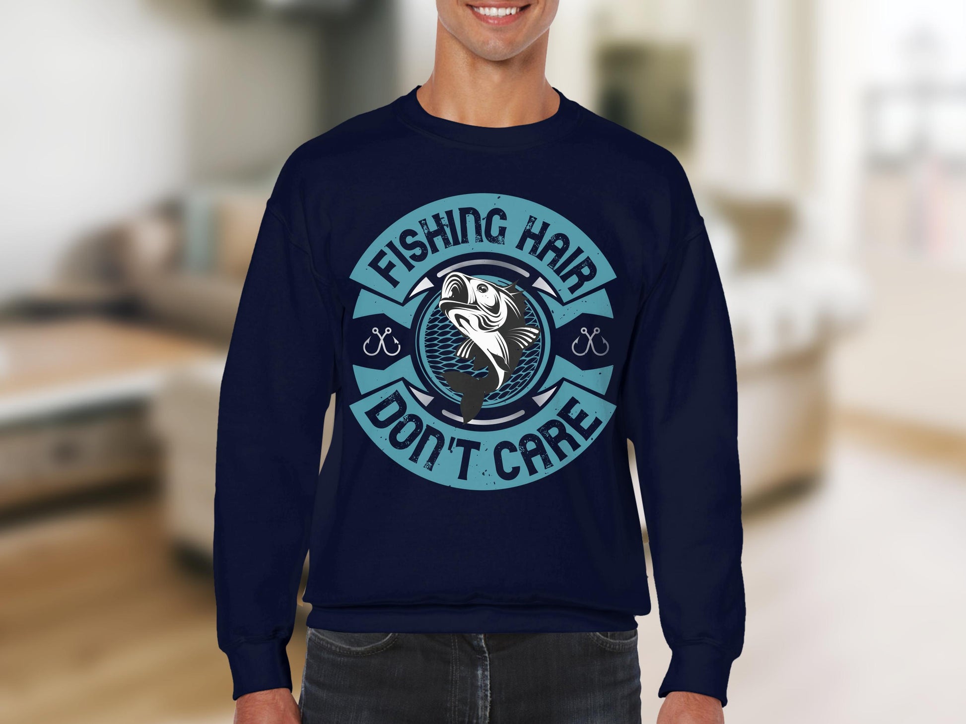 A fishing enthusiast wears Garment Graphics navy blue sweatshirt, showcasing a circular fish graphic and the text Fishing Hair Dont Care, set against a softly blurred, light-colored interior.